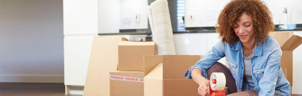 Woman labelling boxes