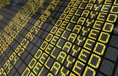 Close-Up of an international airport board panel with all flights delayed