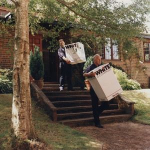 two porters carrying boxes image White & Company