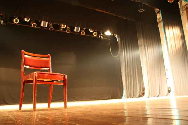 Chair on empty theatre stage