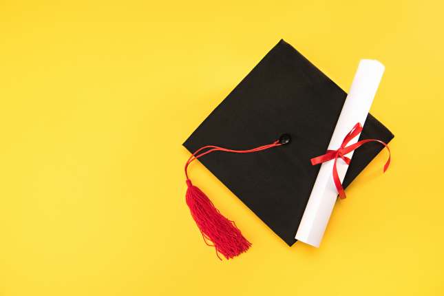 Graduation mortarboard and diploma