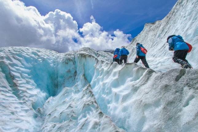 People Hiking on Franz Josef glacier, New Zealand