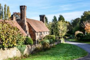 Removals Weybridge, Old cottage with lovely chimneys, Surrey, England
