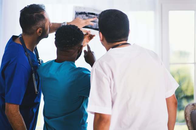 Medical Professionals Looking at X-ray