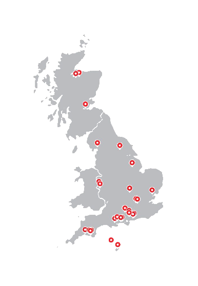 Map of the UK and Channel Islands with White & Company's 24 branches marked as red pins, from the Scottish Highlands to the Channel Islands